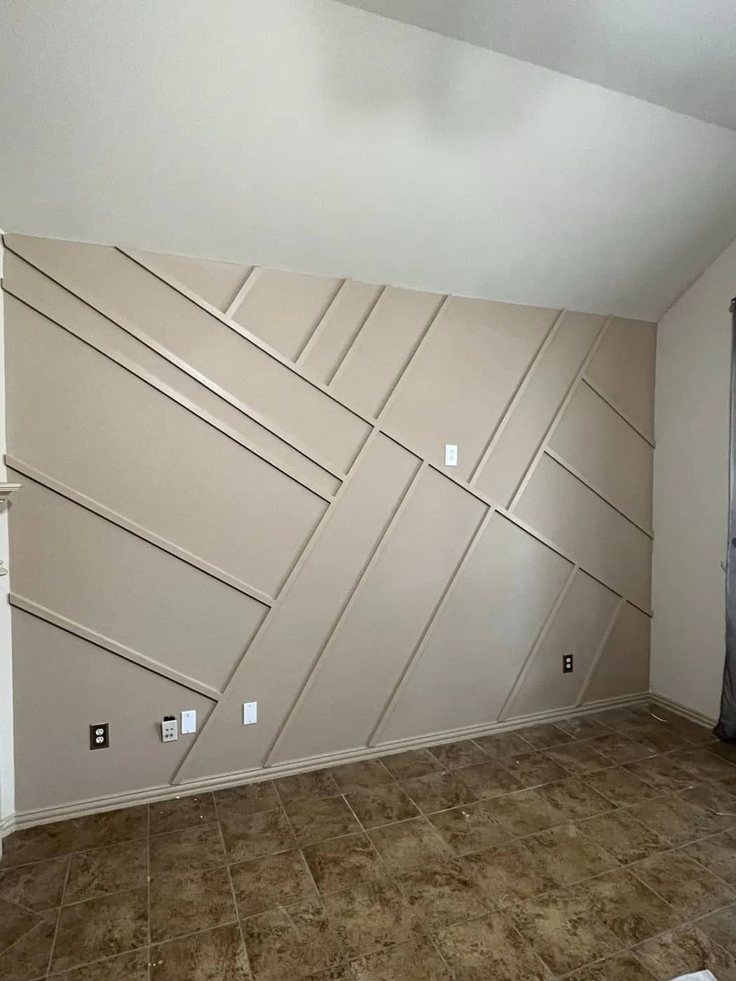 Beige geometric feature wall with dimensional trim