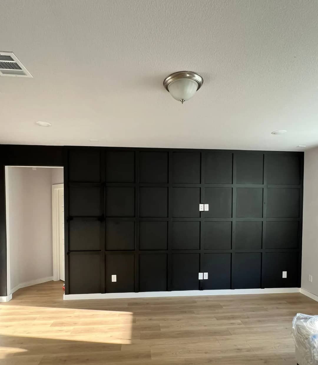 Black grid-panel feature wall