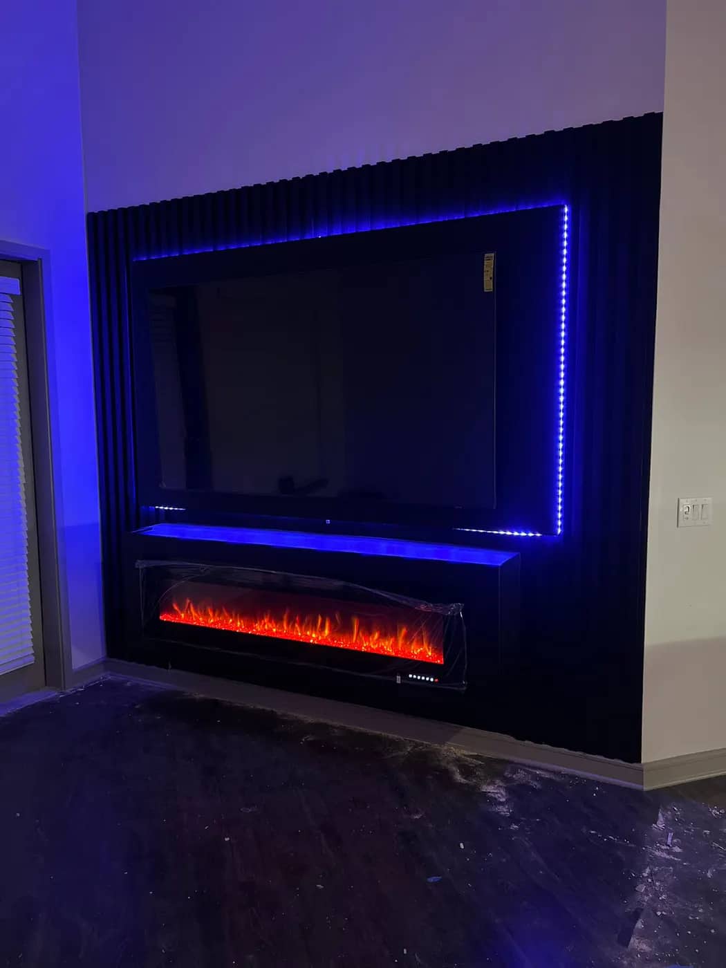 Black fluted media wall during finish installation