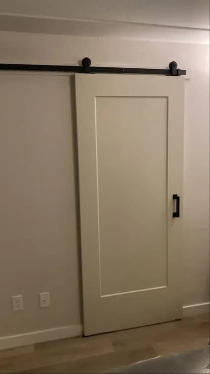 Sliding barn door on a matt black top track