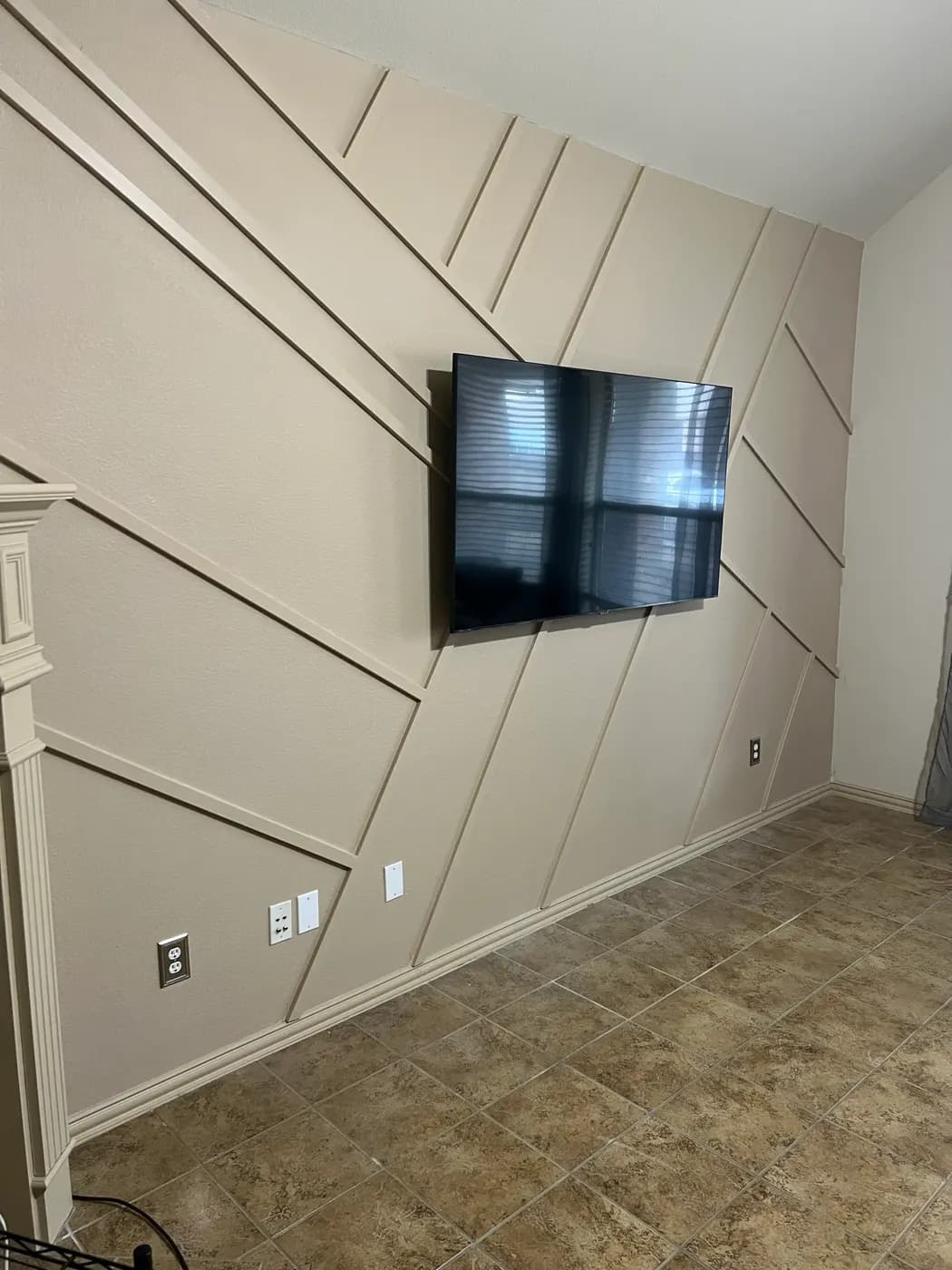Finished beige geometric media wall
