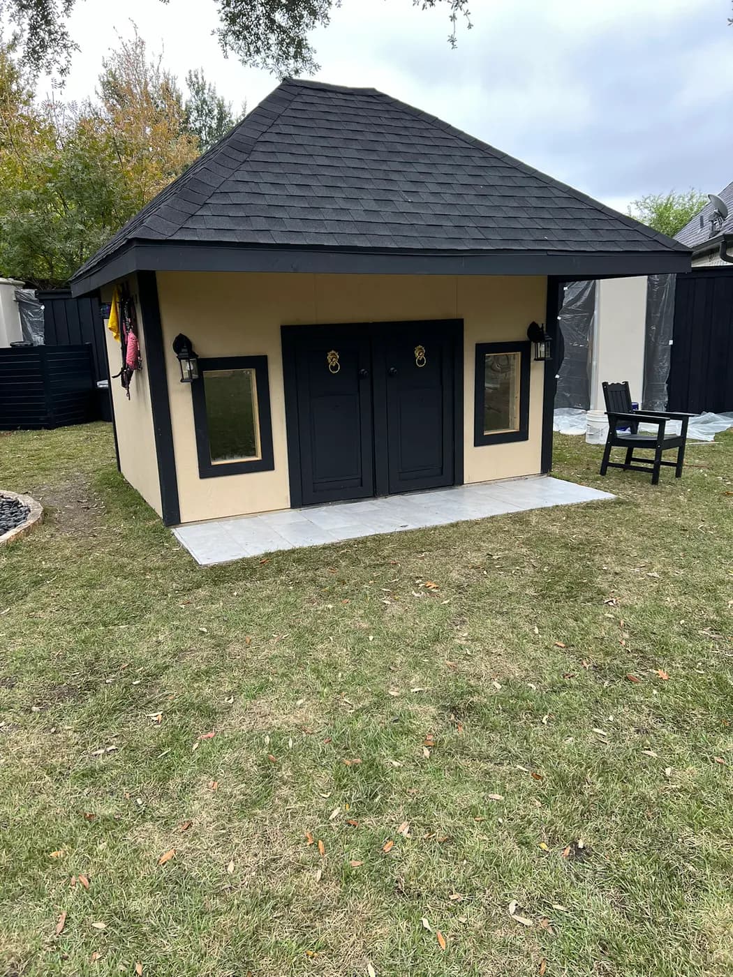 Finished detached cabana beside a swimming pool