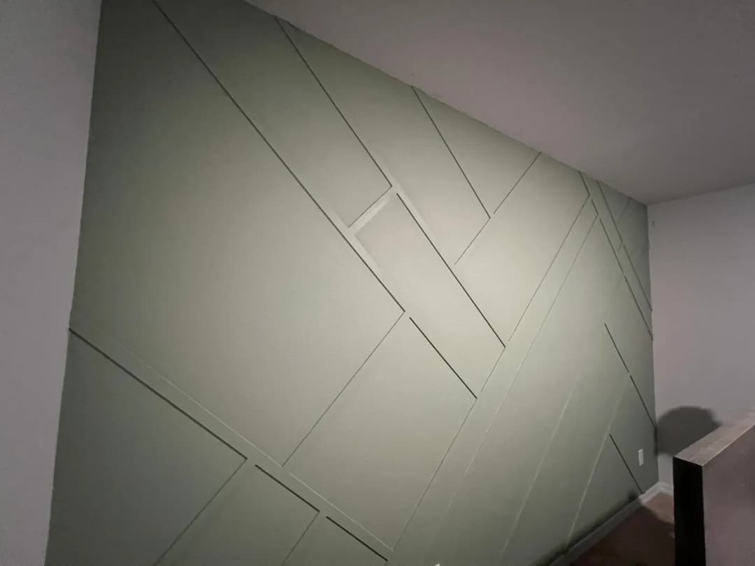 Sage green geometric wall detail