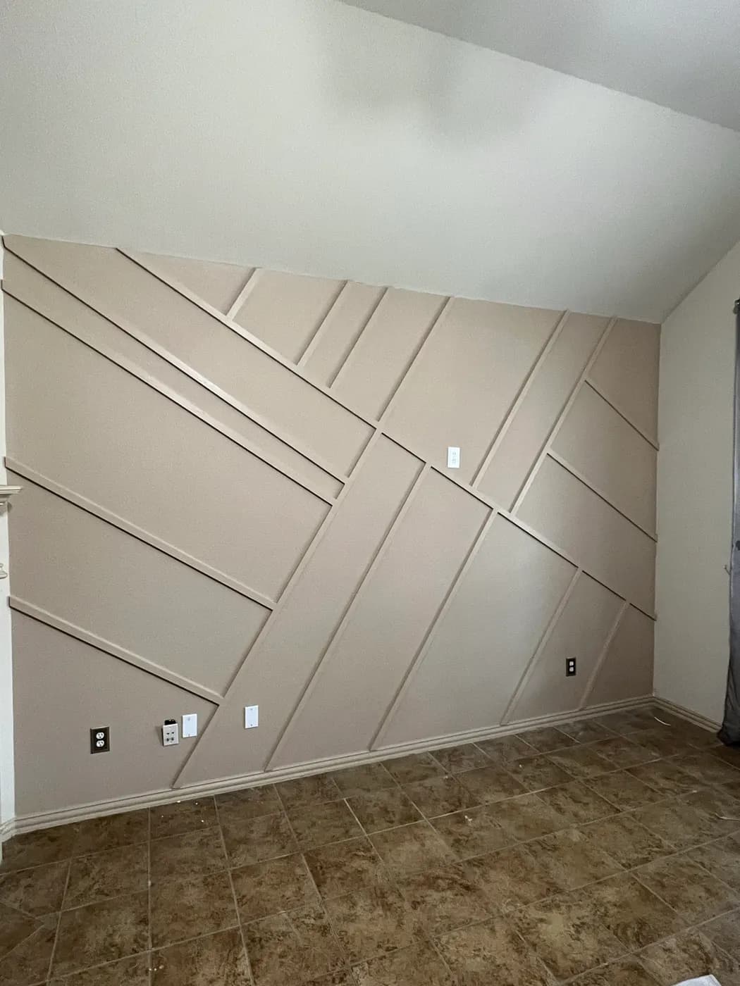Beige geometric feature wall with dimensional trim