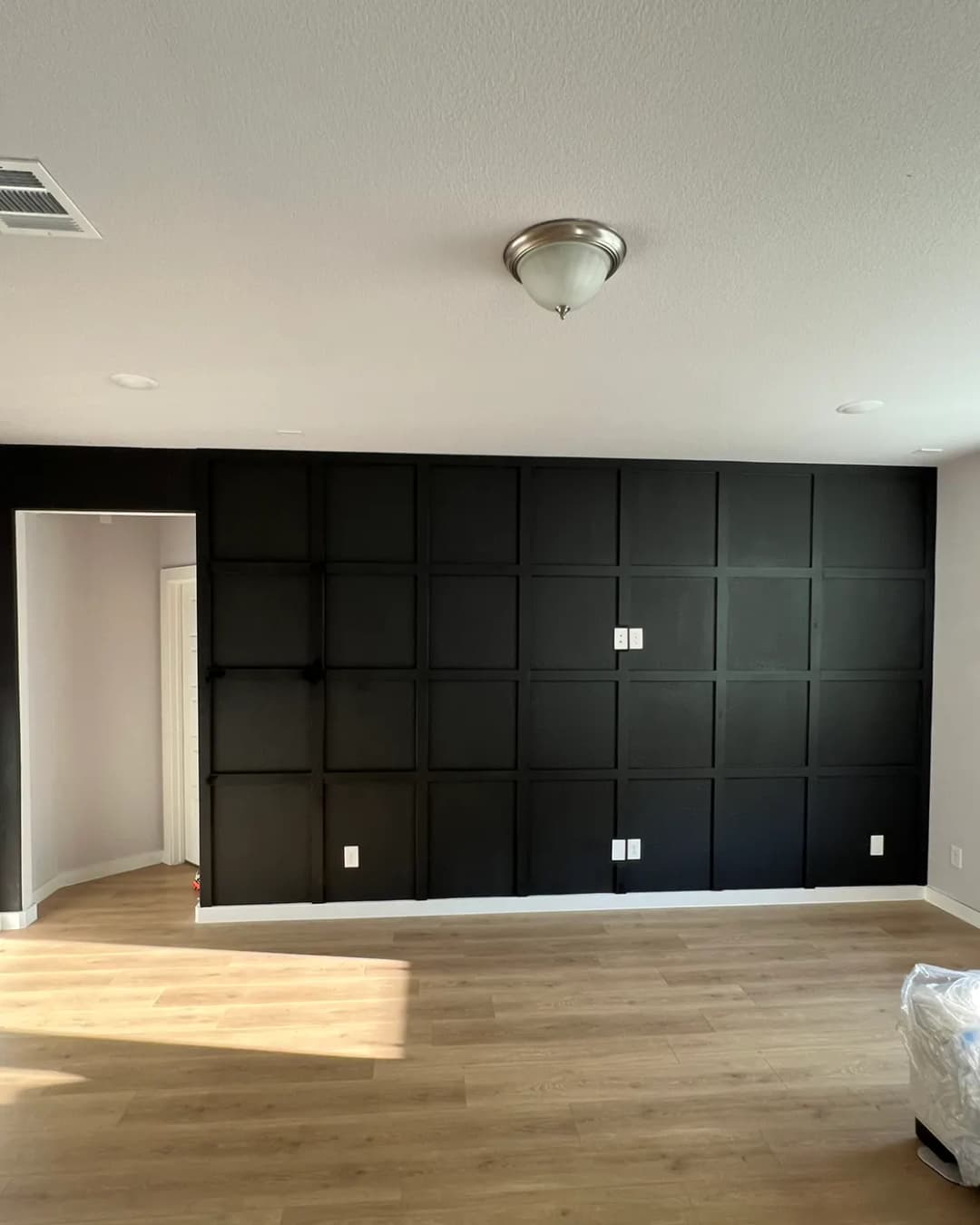 Black grid-panel feature wall